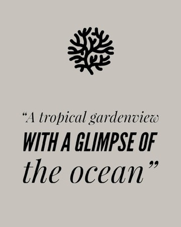A tropical gardenview with a glimpse of the ocean